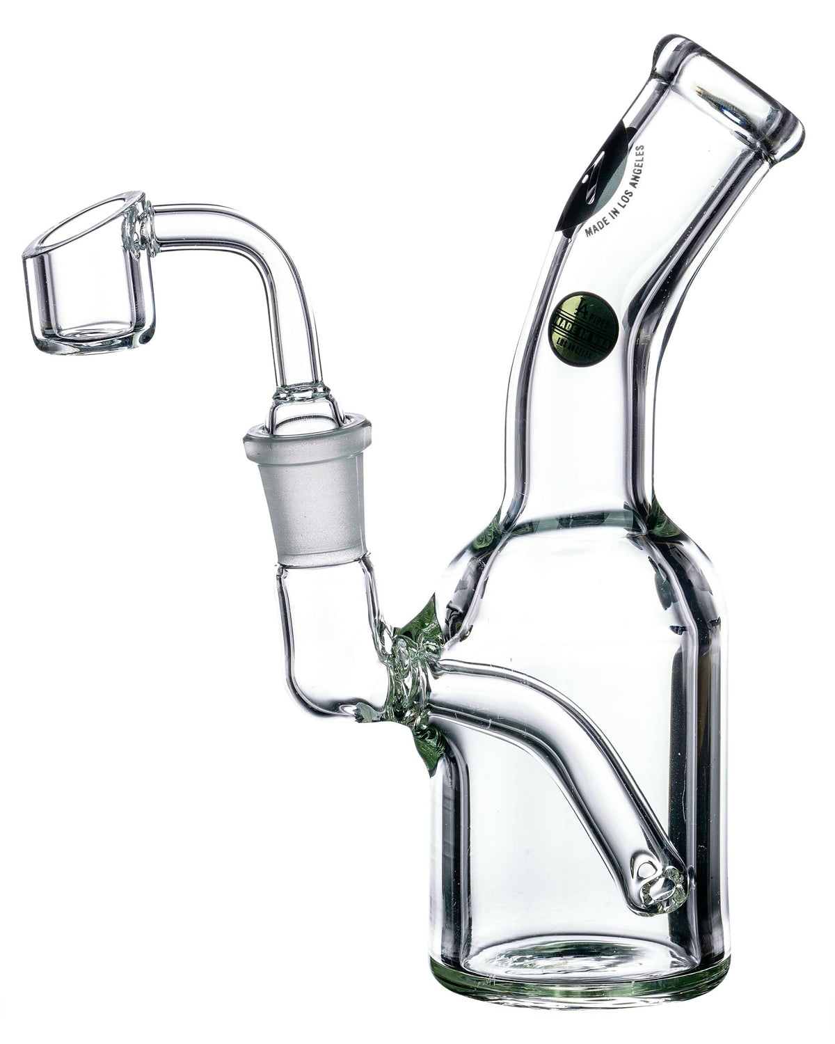 A studio shot of the Heavy Mini Can Dab Rig, displaying its compact size and clear glass construction from a low angle.