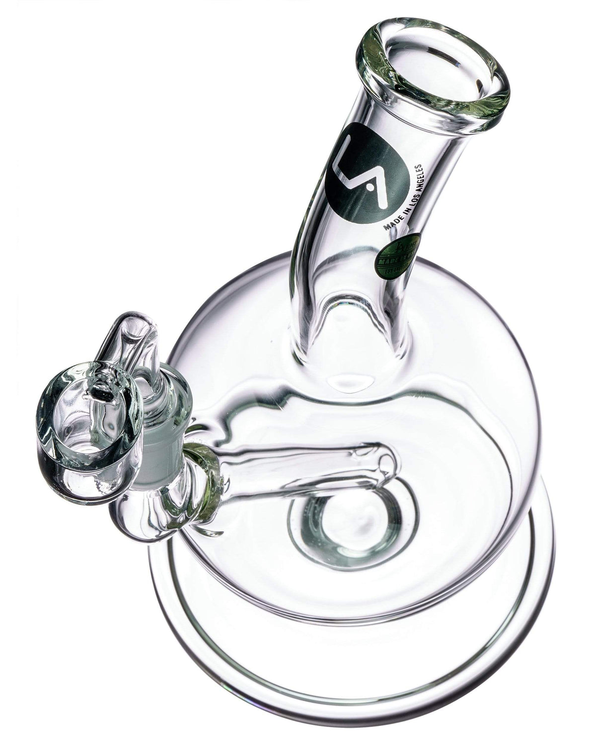 A three-quarter view of the Heavy Mini Pedestal Dab Rig, showcasing its clear glass construction and compact pedestal base.