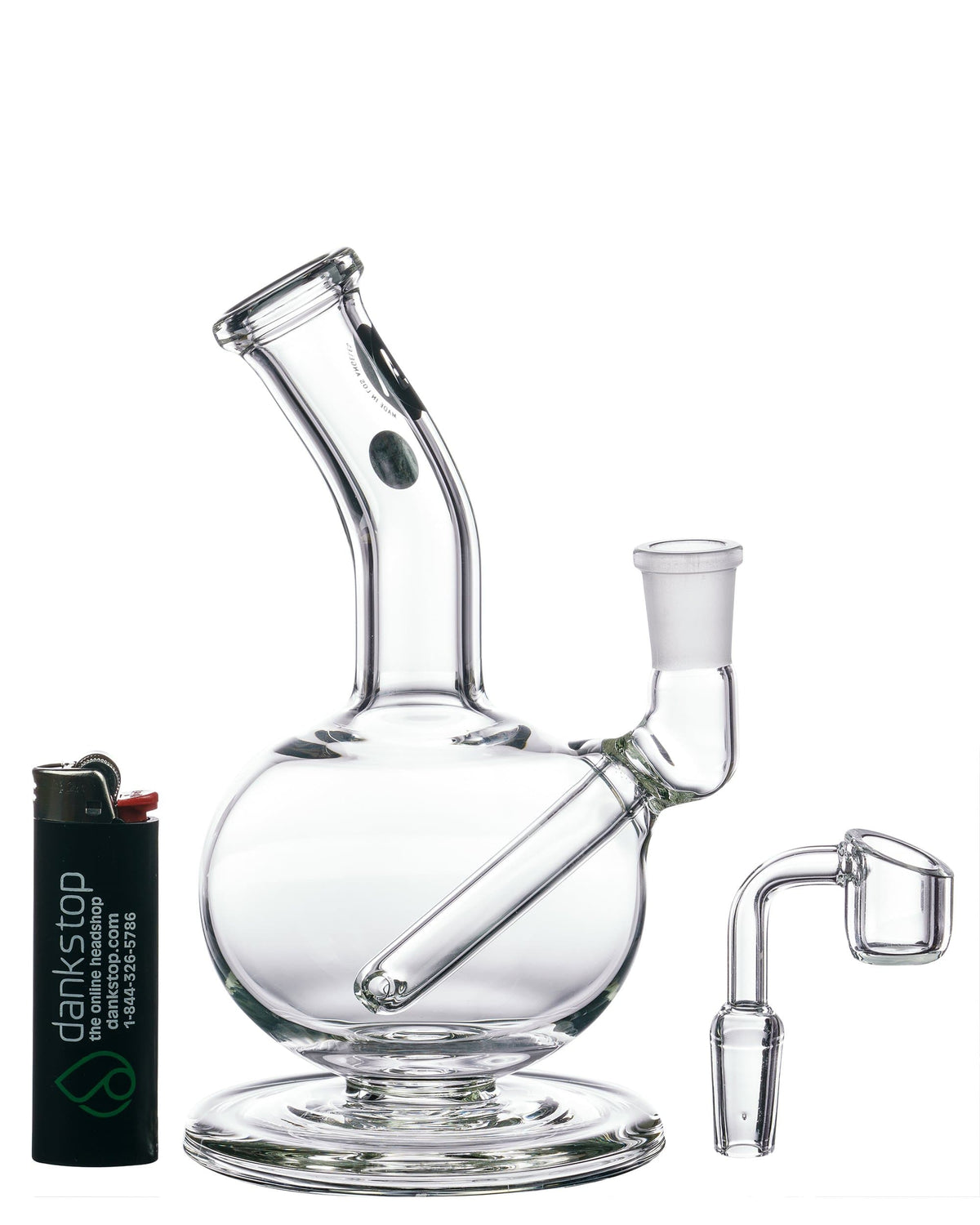 A studio shot of the Heavy Mini Pedestal Dab Rig, displaying its clear glass construction and compact size from a slightly angled view.