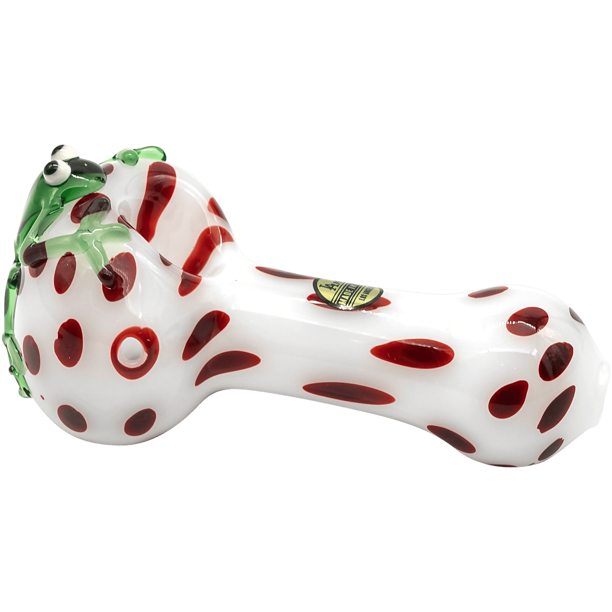 A studio shot of the “Spotted Poison Frog” Spoon Glass Pipe, showcasing its vibrant, patterned design against a plain white backdrop.