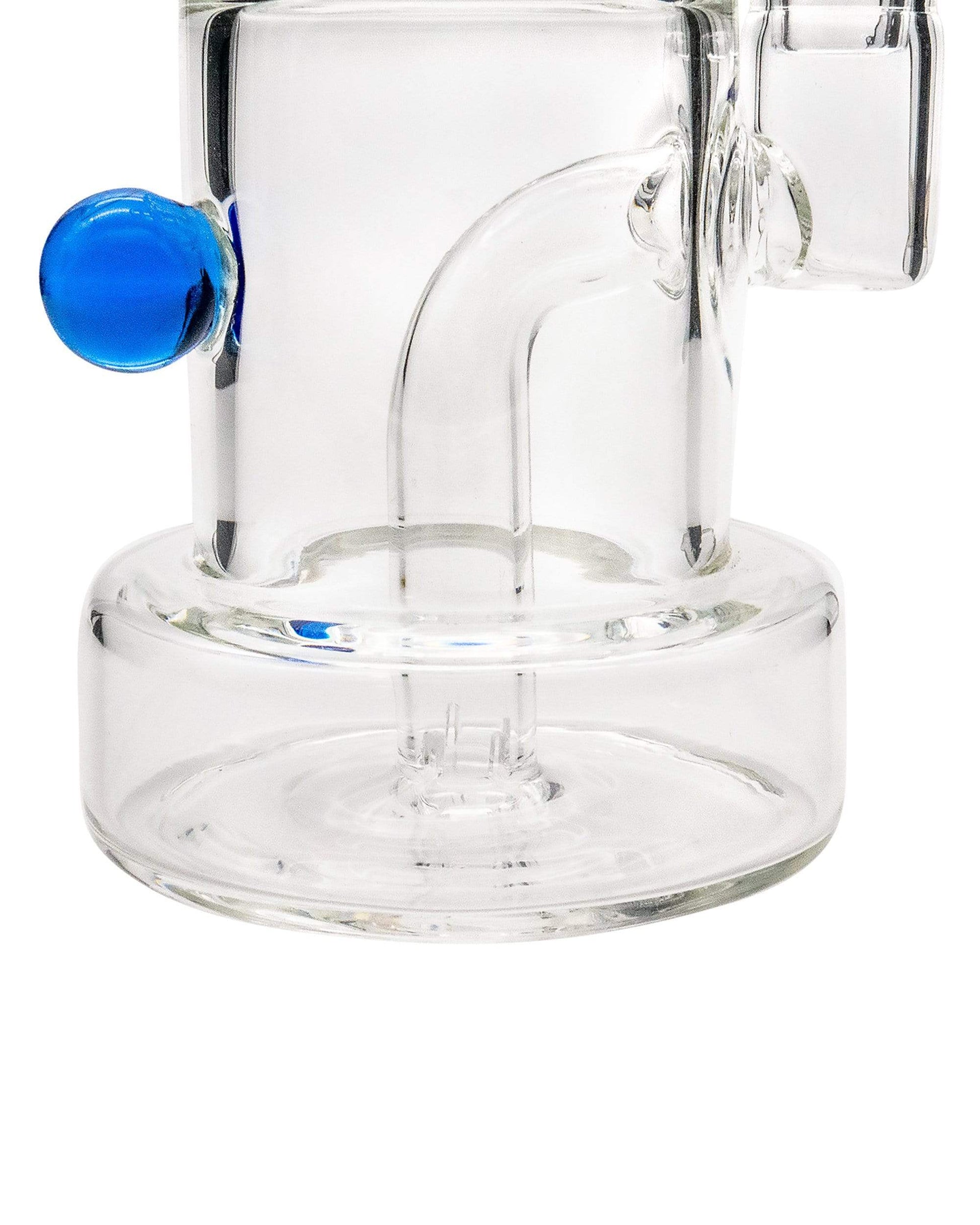 A close-up, angled view of the Layer Cake Color Accented Dab Rig, showcasing its clear glass construction and blue accent.