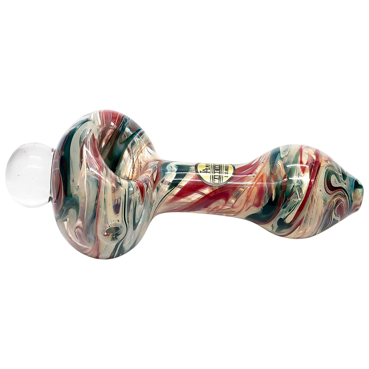 A studio shot of “The Primordial Ooze” Glass Spoon Pipe, showcasing its curved form and vibrant, swirling green and amber glass.
